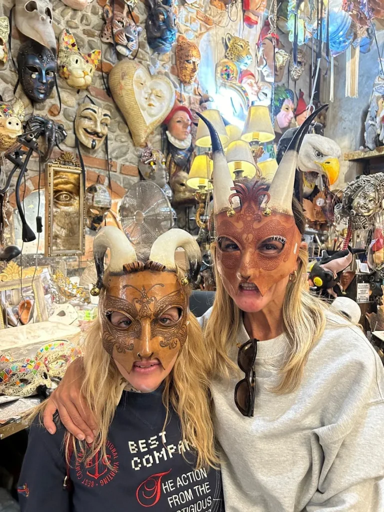 Visitor wearing a handmade mask in the Alice Masks atelier, Florence