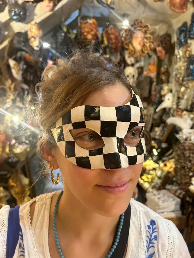 Visitor wearing a handmade mask in the Alice Masks atelier, Florence
