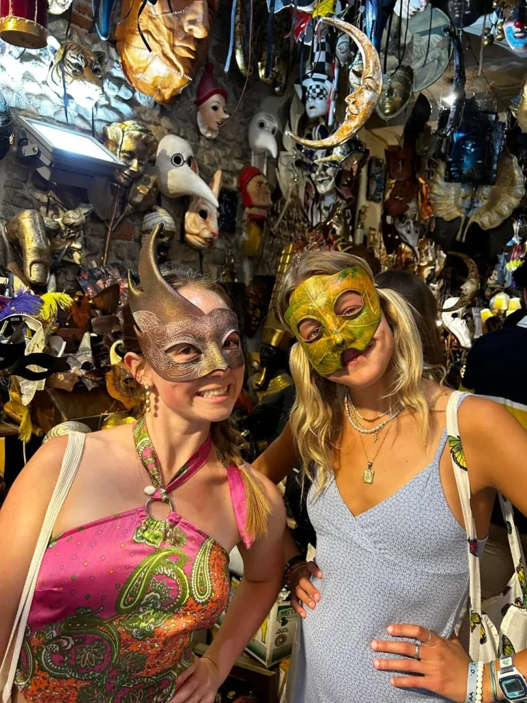 Visitor wearing a handmade mask in the Alice Masks atelier, Florence