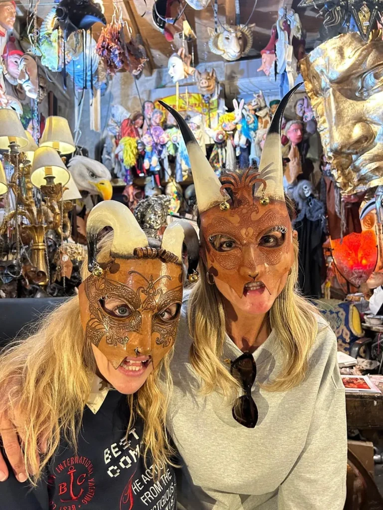 Visitor wearing a handmade mask in the Alice Masks atelier, Florence