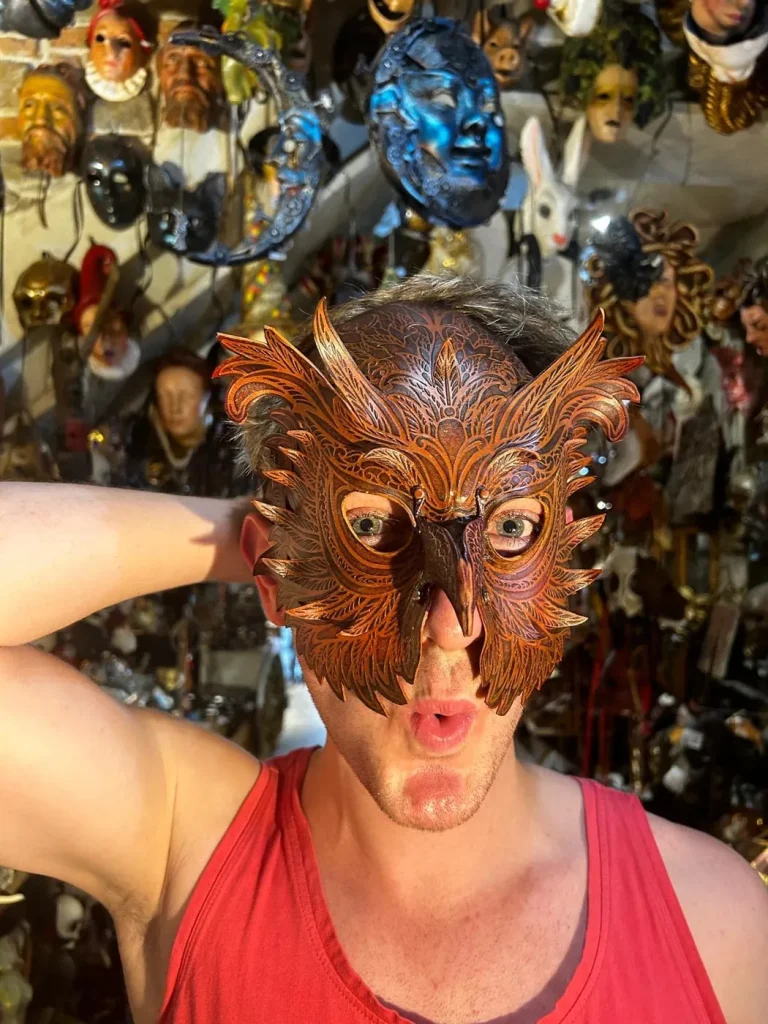 Visitor wearing a handmade mask in the Alice Masks atelier, Florence