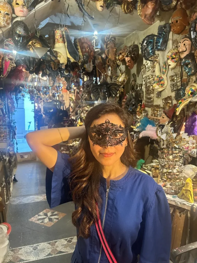 Visitor wearing a handmade mask in the Alice Masks atelier, Florence