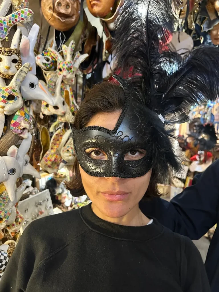 Visitor wearing a handmade mask in the Alice Masks atelier, Florence