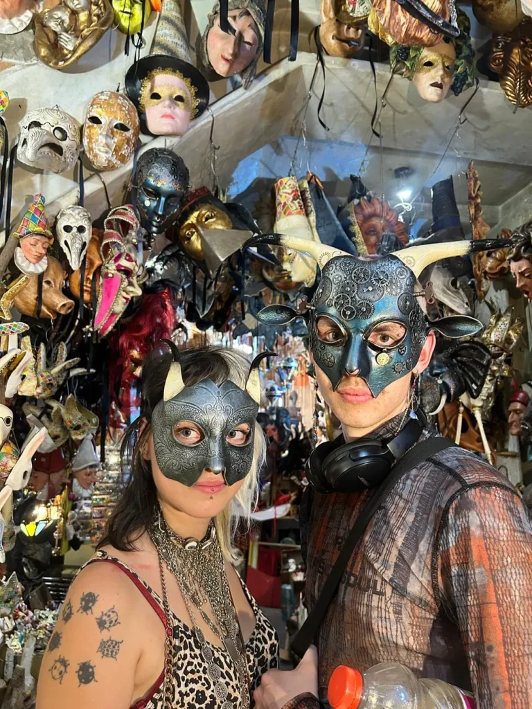 Visitor wearing a handmade mask in the Alice Masks atelier, Florence