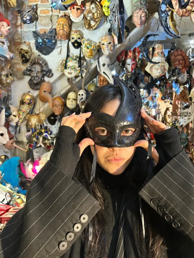Visitor wearing a handmade mask in the Alice Masks atelier, Florence