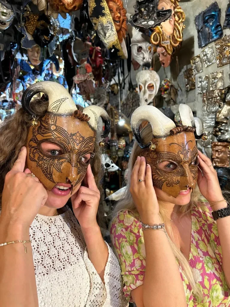 Visitor wearing a handmade mask in the Alice Masks atelier, Florence