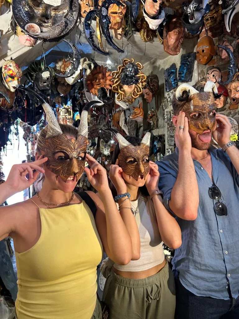 Visitor wearing a handmade mask in the Alice Masks atelier, Florence