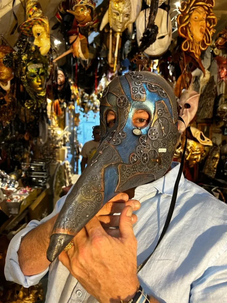 Visitor wearing a handmade mask in the Alice Masks atelier, Florence