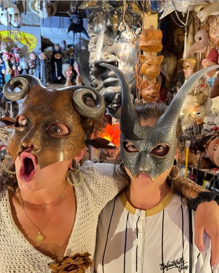Visitor wearing a handmade mask in the Alice Masks atelier, Florence