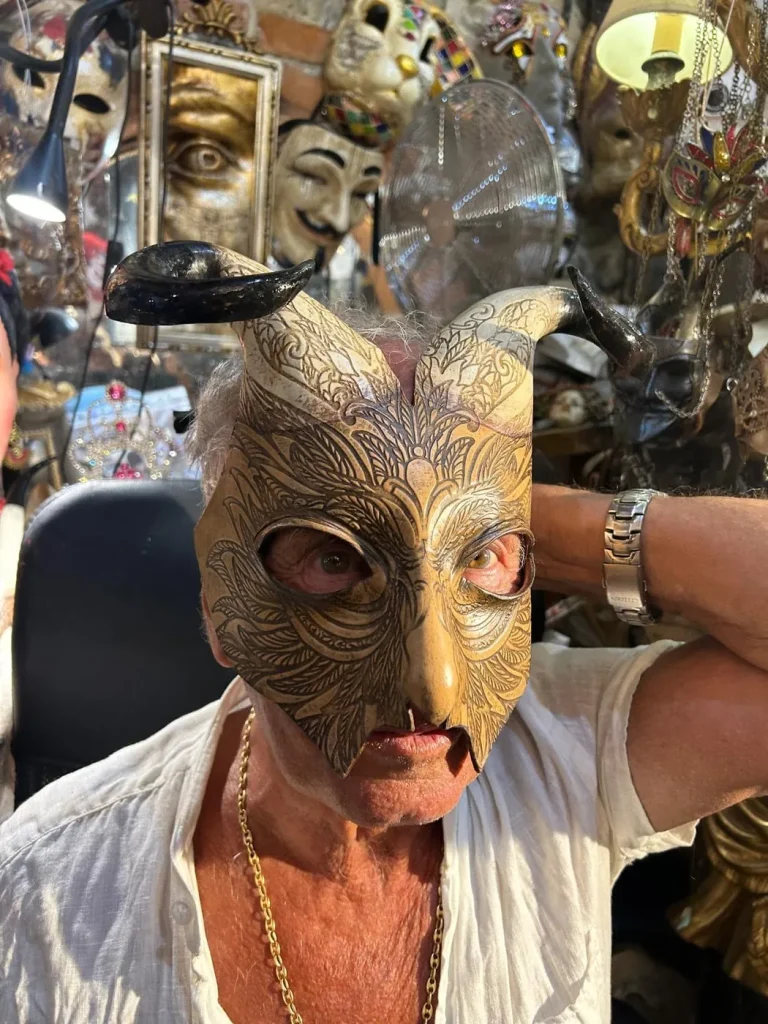 Visitor wearing a handmade mask in the Alice Masks atelier, Florence