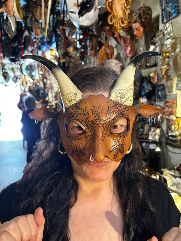 Visitor wearing a handmade mask in the Alice Masks atelier, Florence