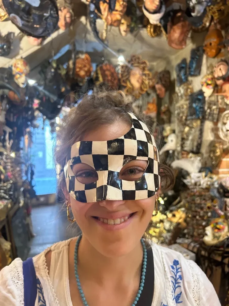 Visitor wearing a handmade mask in the Alice Masks atelier, Florence