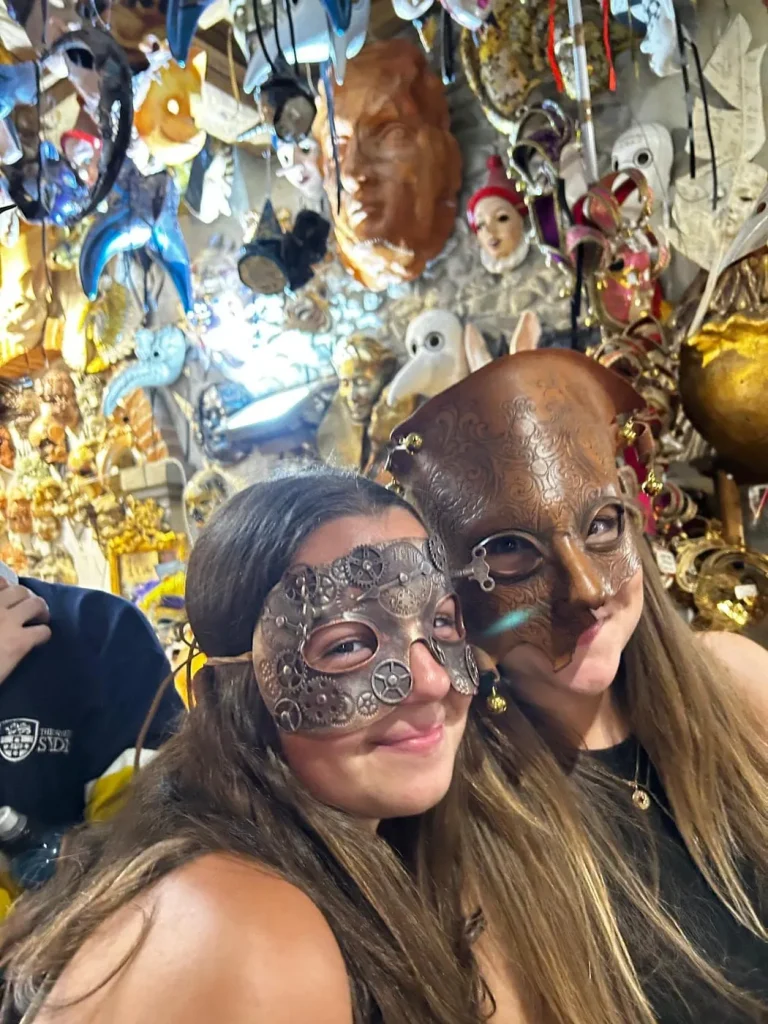 Visitor wearing a handmade mask in the Alice Masks atelier, Florence
