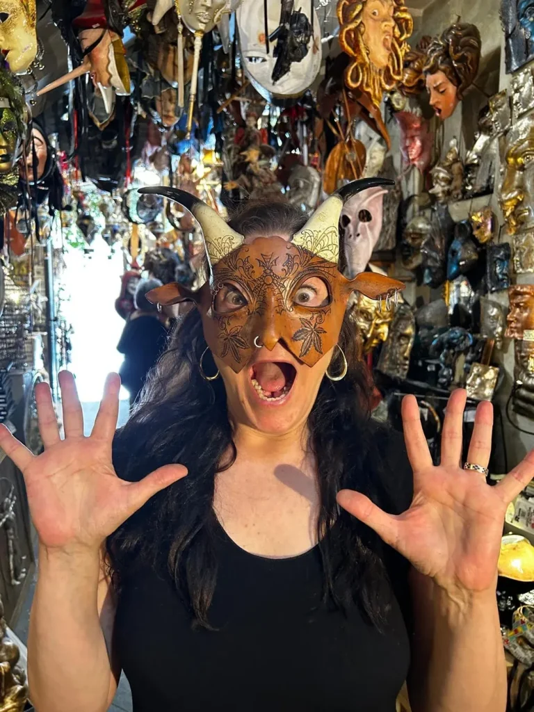 Visitor wearing a handmade mask in the Alice Masks atelier, Florence