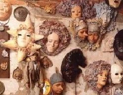 Wall of papier-mâché masks in the Alice Atelier