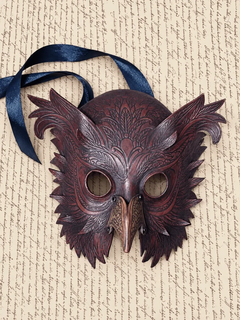 Purple leather owl mask with feathers carved in relief, handmade by Alice Masks, Florence